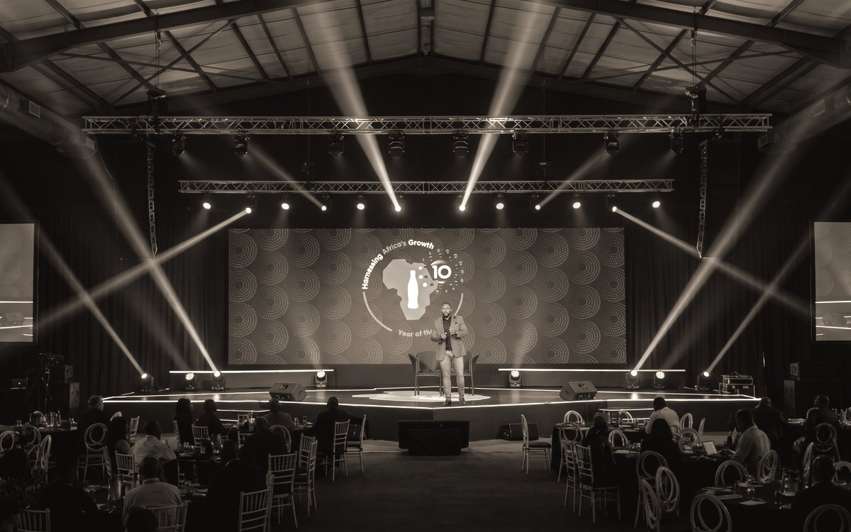 A conference floor under stage lighting, rigged and set